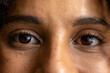 © Wavebreak Media - Close up of eyes of casual biracial businesswoman looking at camera