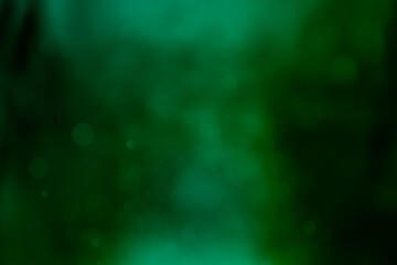 Wall Mural - abstract green light gradient on blurred bokeh glitter background. idea for wallpaper, website, temp