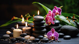 Fototapeta Kwiaty - Towel on fern with candles and black hot stone on wooden background. Hot stone massage setting lit by candles. Massage therapy for one person with candle light. Beauty spa treatment and relax concept.