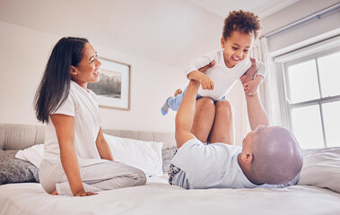 Poster - Happy family, playing and dad with child on bed, bonding and airplane game for father and daughter time in home. Parents, love and playful energy, man holding girl in air and mom laughing in bedroom.