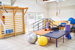 © Robert Kneschke - Bed and various exercise equipment in rehab center