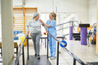 © Robert Kneschke - Physiotherapist assisting senior woman in movement therapy