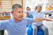 © Robert Kneschke - Elderly people exercising on fitness ball during exercise class