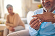 © Bettencourt/peopleimages.com - Senior man, hands and ring in divorce, fight or conflict from disagreement or argument on sofa at home. Elderly couple in depression, infertility or cheating, mistake and toxic marriage in the house