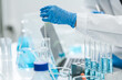 © chokniti - medicine research in chemical laboratory, chemist scientist working with liquid experiment test analysis by using scientific tube beaker glassware, chemistry science pharmaceutical medical lab concept