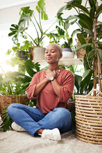 Meditation, Plant And Black Woman Relax In Home For Wellness, Zen Mindset And Calm Energy. Nature, Happy And Face Of Female Person Meditate On Floor With Eco Friendly Ferns, Leaves And House Plants