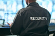 © Bettencourt/peopleimages.com - Office safety, back and man or security for a business or building for service. Law patrol, working and a worker at a professional job as a bodyguard or agent for protection at a workplace or agency