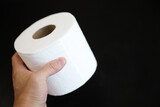 Fototapeta Morze - roll of toilet paper on a clean, white background, symbolizing comfort, hygiene, and the everyday essentials of modern life