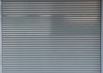steel shutter door background and texture, folding steel door of shop.