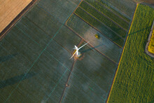 Zero Emission. Top Down Aerial View On A Wind Turbine Eco Farm On Farm Fields Landscape