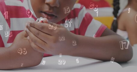 Wall Mural - Animation of numbers over african american schoolboy writing