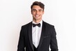 © igolaizola - Handsome young man in tuxedo and bow tie smiling at camera