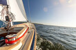 View from a sailing boat sailing on choppy sea on a beautiful summer day