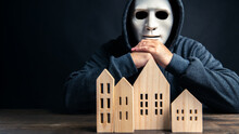 Burglar Thief Considering To Choosing For Stealing Uninhabited Houses In City In Black Dark Background. Social Issues And Criminal Concept. Robber Man Selecting People Home To Break Apartment Crime