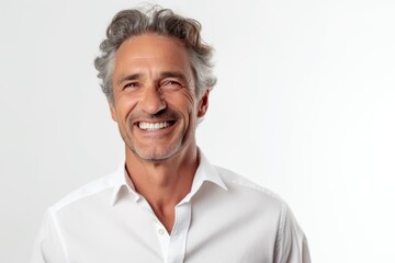 Wall Mural - Portrait of a handsome middle-aged man smiling against white background