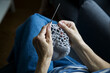 © Irina Ozhigova/Stocksy - Hands knitting