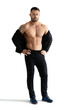 © A Stock Studio - Full length man with bare muscular torso isolated on white background. Bodybuilder
