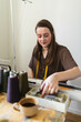 © Diego Martin/Stocksy - Colleagues at tailor studio
