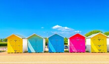 Colourful Beach Huts On The Seafront At Eastbourne, East Sussex, England