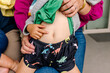 © Erin Brant/Stocksy - Close up of the belly of a cheeky little toddler girl