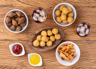 Wall Mural - Coxinha, kibbeh, baked pastel and cheese balls, typical brazilian snacks