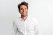 © igolaizola - Portrait of a smiling young man in white shirt on white background