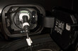 © Alvaro Lavin/Stocksy - electric car charging in home garage