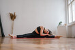 © ISO DUO/Stocksy - Women exercising yoga in activewear