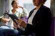 © Jovo Jovanovic/Stocksy - Businesswoman reading notes while commuting