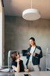 © Studio Firma/Stocksy - Two Businesswomen in Office