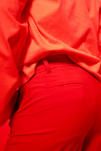 Close-up Of Person Wearing Red Trousers And Red Shirt