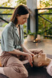 © Stereo Shot/Stocksy - Woman practicing holistic reiki therapy on client