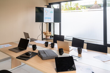 Laptops And Documents At Office Meeting Room Desk
