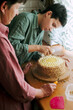 © Duet Postscriptum/Stocksy - Adult daughter and mother cook together homemade lemon cake.