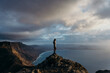 © Berena Alvarez/Stocksy - girl in viewpoint in front of the ocean