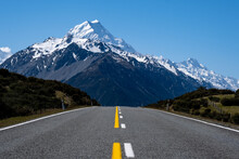 Road Leading To A Snowcapped Mountain