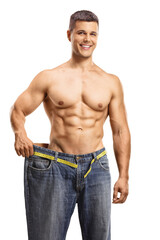 Canvas Print - Smiling young man trying on a big pair of jeans