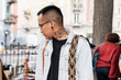 © Mal de Ojo Studio/Stocksy - Man with neck tattoo and glasses