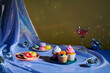 © Marc Tran/Stocksy - Tasty cupcakes, glasses of drink  on table in room