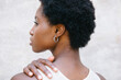 © Berena Alvarez/Stocksy - view of an afro woman in profile