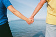 © wendy laurel/Stocksy - family portrait on beach and ocean in maui
