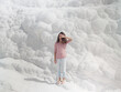 © EASY 2 SHOOT/Stocksy - Young pretty woman having fun in snow-white limestone terrain