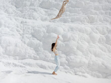 Young Pretty Woman Having Fun In Snow-white Limestone Terrain