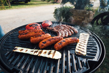 Sausages And Vegetables On A Grill