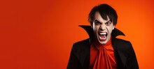 Young Man Dressed As A Vampire For Halloween On A Red Banner With Space For Copy