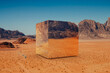 © Marcos Osorio/Stocksy - Surreal landscape with a metal cube in the desert