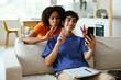 © BONNINSTUDIO/Stocksy - Teenagers taking selfie on smartphone at home