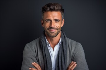 Close-up portrait photography of a satisfied man in his 30s wearing a chic cardigan against a minimalist or empty room background