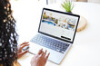 © Trinette Reed/Stocksy - Black woman looking at vacation rental on computer at home