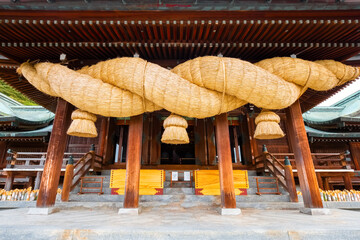 Poster - Fukuoka, Japan - Nov 21 2022: Miyajidake Shrine is primarily dedicated to Empress Jingu, home to five-ton sacred straw rope and attracts over 2 million worshippers a year